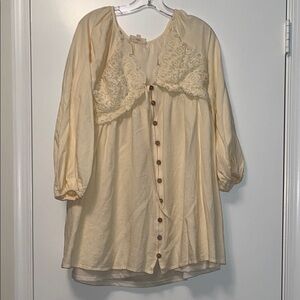 Listicle Cream Top with Subtle Embroidered Logo